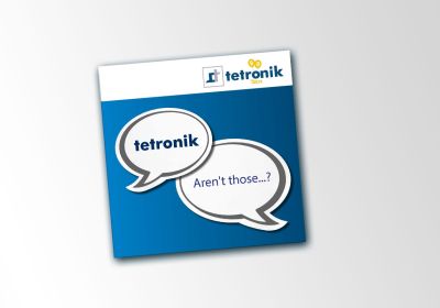 Cover of the tetronik image brochure, rotated slightly counterclockwise, in front of gray gradient
